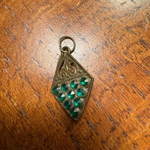 My grandmothers pendant. Don’t know if the stones are authentic. 50 plus yrs old